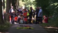 Passengers of a public service bus receive medical treatment in Kuecknitz near Luebeck northern Germany, after several people were injured in the bus in an assault by a man wielding a knife on July 20, 2018. (AFP / dpa)
