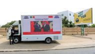 Chinese President Xi Jinping's visit to Senegal is advertised with posters printed across the side of a truck in Dakar, Senegal July 21, 2018. Reuters/Mikal McAllister