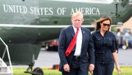 U.S. President Donald Trump and First Lady Melania Trump disembark Marine One upon departure from Morristown in New Jersey, U.S., July 22, 2018. REUTERS/Mary F. Calvert