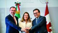 Mexican Foreign Minister Luis Videgaray, Canadian Minister of Foreign Affairs Chrystia Freeland and Mexican Economy Minister Idelfonso Guajardo pose for pictures after a press conference at the Foreign Office in Mexico City, on July 25, 2018. AFP / Ronald