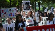Protesters and their children participate in a march prior to a sit-in in the Hart Senate Office Building to mark the court-ordered deadline for the Trump Administration to reunify thousands of families separated at the border July 26, 2018 in Washington,