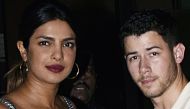 Indian Bollywood actress Priyanka Chopra (L) and US singer Nick Jonas stand together in Mumbai on June 22, 2018. AFP


