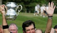 US Senior Open winner Bruce Lietzke of Dallas, Texas holds up the trophy after winning the championship, at the Inverness Club in Toledo, Ohio, June 29, 2003. Lietzke won the tournament by two strokes over Tom Watson. Reuters/Tim Aubry