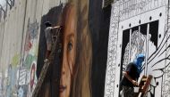 Israeli lawyer Gaby Lasky speaks with Ahed Tamimi before she stands for a hearing in the military court at Ofer military prison in the West Bank village of Betunia on January 1, 2018. (AFP / Ahmad Gharabli) 