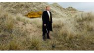 Donald Trump, pictured here on the sand dunes of the Menie estate near Aberdeen, Scotland, in 2010, has said his golf investments are valuable long-term property plays. Reuters/David Moir