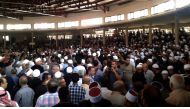 A handout picture released by the official Syrian Arab News Agency (SANA) shows Syrians during a mass funeral of yesterday's suicide attacks victims in the southern city of Sweida on July 26, 2018. (AFP / SANA)