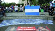 Nicaraguan refugees fleeing their country due to unrest display signs with the names of Nicaraguans who died during clashes with riot police in La Merced park in San Jose, Costa Rica, July 29,2018. Reuters/Juan Carlos Ulate

