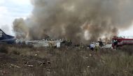 Rescue personnel work at the site where an Aeromexico-operated Embraer passenger jet crashed in Mexico's northern state of Durango, July 31, 2018, in this picture obtained from social media. (Proteccion Civil Durango/via REUTERS )