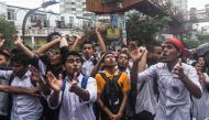  Bangladeshi students block a road during a student protest in Dhaka on August 2, 2018, following the deaths of two college students in a road accident on July 30.  AFP / Munir Uz Zaman