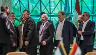 Egyptian Intelligence services head Khaled Fawzi laugh with Hamas leader Izzat al-Rishq and Hamas leader Yahya Sinwar in the presence of Azzam al-Ahmad and Rawhi Fattouh of Fatah (AFP / Khaled Desouki) 