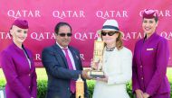 Abdullah Khalifa Al Kubaisi giving trophy to the Qatar Stewards’ Sprint Handicap Stakes winner. 