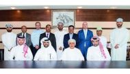 Abdul Aziz bin Nasser Al Khalifa (sitting, second left), Chairman, ELAN Group; Jaber Abdullah Al Ansari (sitting, right), CEO, ELAN Group; and Sheikh Mahmood Al Jarwani (sitting, second right), Chairman of TAMANI Global Development & Investment with other