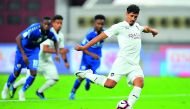 Al Sadd’s Algerian forward Baghdad Bounedjah shoots from penalty spot to score against Al Kharaitiyat during their QNB Stars League match played at the Khalifa International Stadium yesterday. Pictures by: Baher Amin / The Peninsula
