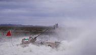 A tank drives through the water during the Suvorov Attack contest at the International Army Games 2018 in Korla, Xinjiang Uighur Autonomous Region, China July 30, 2018.  Zhang Zhitao/Southern Metropolis Daily via Reuters 