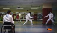 Athletes compete at the fencing event of the 2018 Gay Games at the Salle Armand Massard in Paris on August 5, 2018. AFP / Lucas Barioulet 