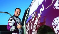 Qatari driver Adel Abdulla gestures after winning an event.