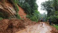 Indian rescuers conduct rescue operations after a landslide at Kuttampuzha village in Ernakulam district in the Indian state of Kerala on August 9, 2018.  AFP 
