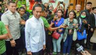 Indonesian President Joko Widodo (C) arrives to hold a meeting with coalition party leaders in Jakarta, Indonesia August 9, 2018 in this photo taken by Antara Foto. Galih Pradipta via Reuters