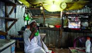A Rohingya refugee man drinks tea at a local tea stall at the Kutupalong camp in Ukhia near Cox's Bazar on August 10, 2018. AFP / Chandan Khanna