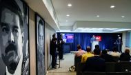 Venezuela's Communications Minister Jorge Rodriguez (C), offers a press conference on the detention of opposition lawmaker, Juan Requesens, accused of involvement in an apparent attack against President Nicolas Maduro, at the Miraflores presidential palac