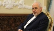 Iran's Foreign Minister Mohammad Javad Zarif listens during Iranian President Hassan Rouhani meeting with North Korea's Foreign Minister Ri Yong Ho in the capital Tehran on August 8, 2018. / AFP / ATTA KENARE 