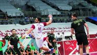A Qatari handball player in action during a friendly match in this file photo.