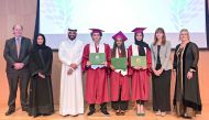 QA Sidra International Baccalaureate Diploma Programme graduates with officials.