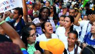 People shout as they take part in a protest of workers of the health sector due to the shortages of medicines and for higher wage, outside a public children hospital in Caracas, Venezuela August 16, 2018. Reuters/Marco Bello
