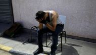 A friend of Sadi Moamer, 26, who was killed during demonstrations near Rafah, mourns outside of a hospital near Rafah on August 17, 2018.  AFP / Said Khatib 