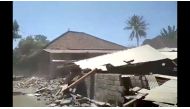 Debris and dust is seen after a building collapsed during an earthquake in lombok, Indonesia, August 19, 2018 in this still image obtained from a social media video. Amre Mogen /via REUTERS 
