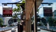  A car passes by a security booth with a bullet hole in a window, at the entrance of the US Embassy, in Ankara, on August 20, 2018. (AFP)