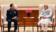 This handout photograph released by India's Press Information Bureau (PIB) on August 21, 2018 shows Indian Prime Minister Narendra Modi (R) meeting with China's Defense Minister Wei Fenghe in New Delhi. AFP / PIB