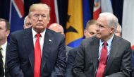 US President Donald Trump (L) sits with Attorney General Jeff Sessions in Quantico, Virginia, before participating in the FBI National Academy graduation ceremony on December 15, 2017.  AFP / Nicholas Kamm 