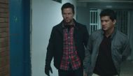 Still of the actors Mark Wahlberg (L) and Iko Uwais (R) from the movie Mile 22.