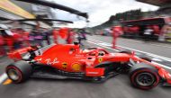 Ferrari's German driver Sebastian Vettel drives in the pits during the third practice session at the Spa-Francorchamps circuit in Spa on August 25, 2018 ahead of the Belgian Formula One Grand Prix. / AFP / EMMANUEL DUNAND