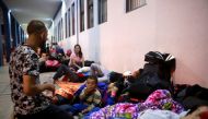 Venezuelan migrants wait at the Binational Border Service Center of Peru, on the border with Ecuador, in Tumbes, Peru August 25, 2018. REUTERS/Douglas Juarez
