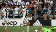 Lazio's Albanian goalkeeper Thomas Strakosha (R) defends against Juventus' Portuguese forward Cristiano Ronaldo during the Italian Serie A football match Juventus vs Lazio on August 25, 2018 at the Allianz Stadium in Turin. / AFP / Filippo MONTEFORTE