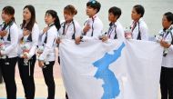 Unified Korea's gold medallists sing the national folk song 