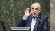 Masoud Karbasian, Iran's Economy Minister, speaks in parliament in the capital Tehran on August 26, 2018 before a vote by lawmakers which saw him impeached. / AFP / ATTA KENARE 
