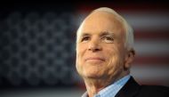 Republican presidential candidate John McCain pauses while addressing a campaign event at the Freedom Hill Ampitheatre in Sterling Heights, Michigan, on September 05, 2008. AFP / Robyn Beck

