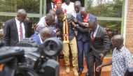 Uganda's prominent opposition politician Robert Kyagulanyi known as Bobi Wine (C) walks ahead of appearing at the general court martial in Gulu, northern Uganda on August 23, 2018. (AFP)