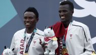 Gold medalists Cherif Younousse Samba and Ahmed Tijan Janko of Qatar pose on the podium. REUTERS/Edgar Su