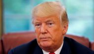 FILE PHOTO: U.S. President Donald Trump listens to a question during an interview with Reuters in the Oval Office of the White House in Washington, U.S. August 20, 2018. REUTERS/Leah Millis