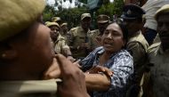 A Progressive Organisation for Women (POW) activist scuffles with police during a protest against the arrest of Indian poet and activist Varavara Rao in Hyderabad, on August 29, 2018. AFP / Noah Seelam
 