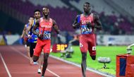 Qatar’s Abdalelah Hassan Haroun (right) wins the  second heat of the men’s 4x400m relay event during the 2018 Asian Games in Jakarta, Indonesia, yesterday.