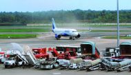 A plane is seen at the taxiway after landing at Kochi's International airport in the Indian state of Kerala on August 29, 2018, after the airport reopened following flooding caused by monsoon rains.  AFP