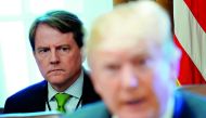 White House Counsel Don McGahn sits behind U.S. President Donald Trump as the president holds a cabinet meeting at the White House in Washington,  June 21, 2018. Reuters/Jonathan Ernst
