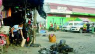A police investigator (L) gathers evidence at the site of a bomb blast in Isulan town on the southern island of Mindanao on Augiust 29, 2018. AFP
