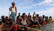 FILE PHOTO: Rohingya refugees cross the Naf River with an improvised raft to reach to Bangladesh in Teknaf, Bangladesh, November 12, 2017. REUTERS/Mohammad Ponir Hossain
