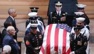 The casket is pictured leaving the memorial service of U.S. Senator John McCain (R-AZ) at National Cathedral in Washington, U.S., September 1, 2018. REUTERS/Chris Wattie